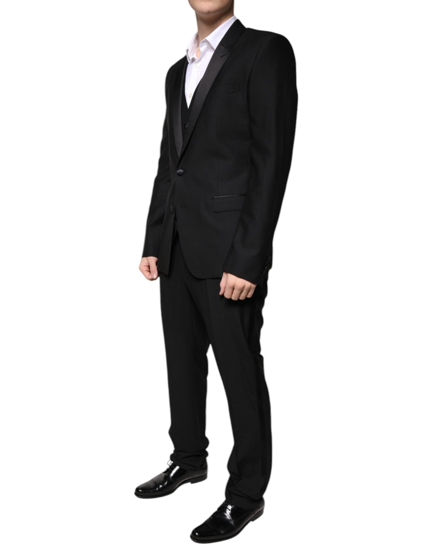 Tuxedo by Dolce & Gabbana for men in virgin wool silk & viscose black features a definitive silhouette, showcasing a sophisticated and definitive slim for a refined, formal look.