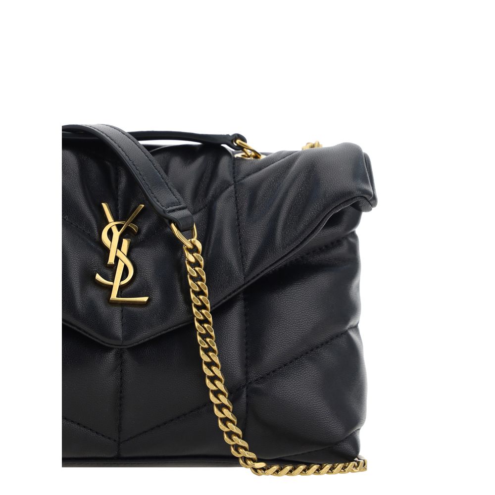 Compact Shoulder Flap Bag by Saint Laurent for women in lambskin leather black & chevron features an effortlessly chic silhouette with a secure flap & magnetic, ample , and versatile shoulder-strap for effortlessly chic everyday luxury.