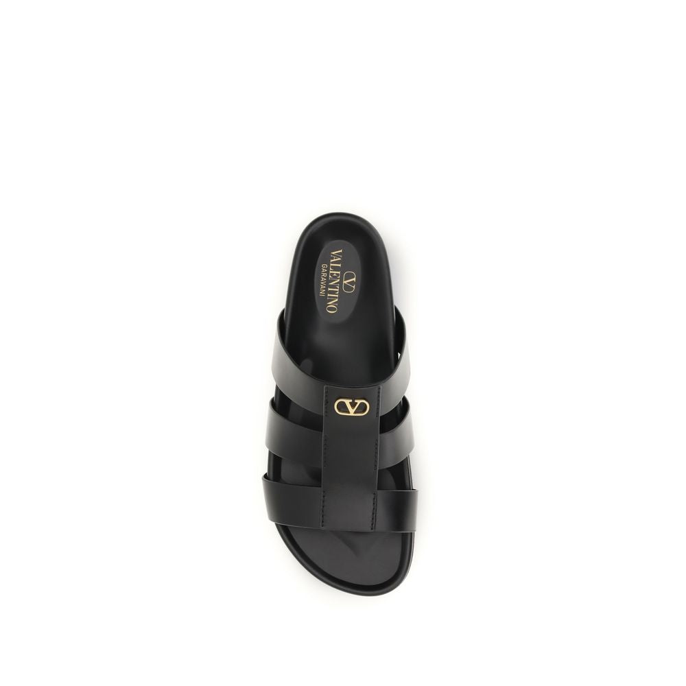 Slider Cage Sandals by Valentino Garavani for men in bos taurus calfskin leather black & signature features an architectural design from the V Logo Men's Bos Taurus Calfskin Leather Slider Cage Sandals collection, defined by a architectural and for a architectural finish.