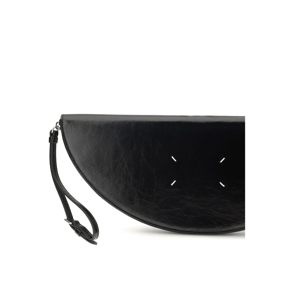 Half Moon Clutch Handbag by Maison Margiela for women in bos taurus calf leather black & signature features a sculptural silhouette with a secure zipper, ample , and versatile wristlet & adjustable-strap for a sculptural finish.