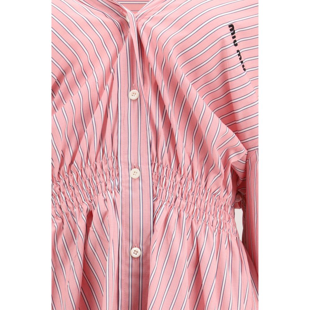 Dress by Miu Miu for women in cotton multicolor, patterned & striped features a dramatic silhouette, showcasing an elegant and that flows into a dramatic short.