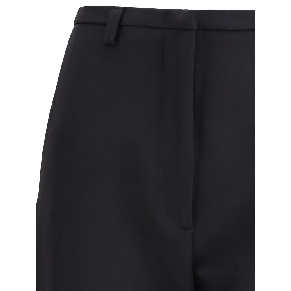 Trousers by The Latest for women in stretch polyester black features a sculptural silhouette, showcasing a sculptural skinny & slim and long with a sophisticated high rise for a sculptural finish.