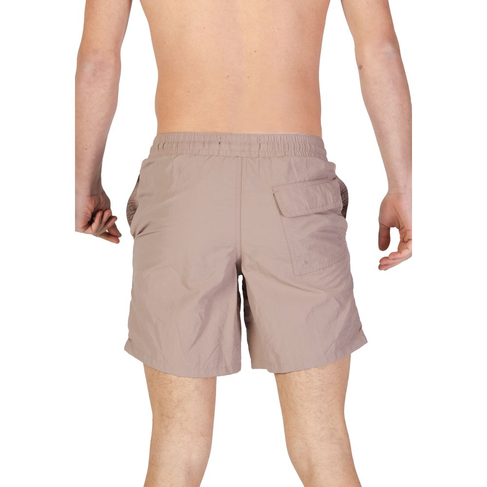 Swim Shorts by Lyle & Scott for men in nylon and beige showcases a sinuous silhouette, expertly cut for a sinuous fit as part of the Men's Lightweight Nylon Swim Shorts collection.