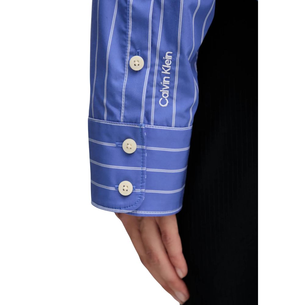 Shirt by Calvin Klein Jeans for women in cotton blue showcases a sleek silhouette, elegantly detailed with a sleek and for a sleek finish.