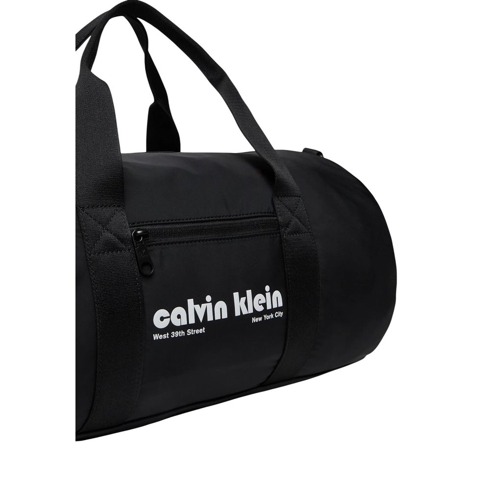 Travel Gym Duffel Bag by Calvin Klein for men in polyester black presents a refined silhouette from the Polyester Travel Gym Duffel Bag collection, featuring a refined zipper, ample , and versatile crossbody-strap, shoulder-strap, adjustable-strap & handle.