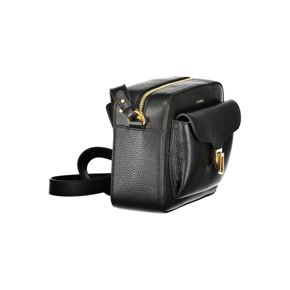 Handbag by Coccinelle for women in leather black, signature & print features a signature silhouette, showcasing a secure zipper and signature external-pockets & internal-pockets with versatile shoulder-strap & adjustable-strap for a sophisticated look.