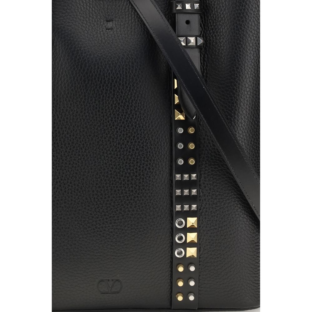 Medium Tote Shoulder Bag by Valentino Garavani for men in bos taurus calf leather black, gold & silver features a effortless chic silhouette with a secure buckle & button, ample , and versatile adjustable-strap & handle for a effortless chic finish.