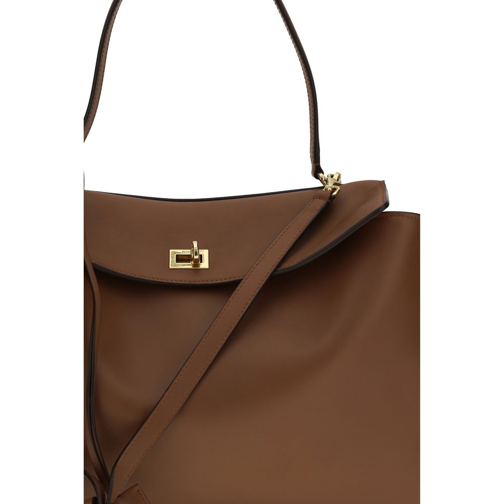 Shoulder Flap Bag by Balenciaga for women in bos taurus calf leather brown features an effortlessly chic silhouette with a secure snap & flap, ample , and versatile shoulder-strap & handle for effortlessly chic everyday luxury.