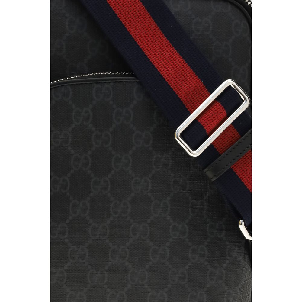 Shoulder Bag by Gucci for men in tu polyester polyurethane cotton canvas black, silver & patterned showcases a enviable silhouette, artfully detailed with a secure zipper, organized , and versatile shoulder-strap & adjustable-strap for a enviable look.