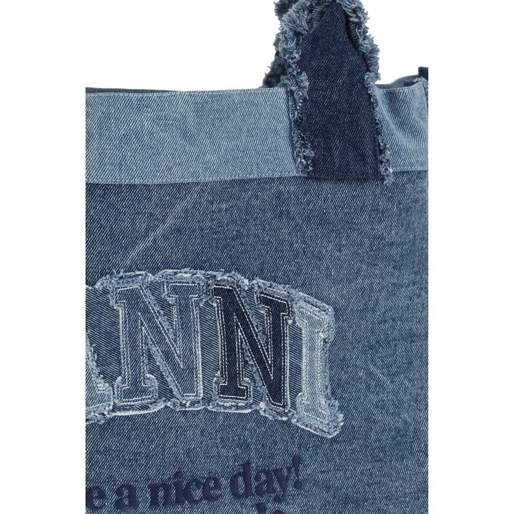Medium Shopper Trapeze Handbag by Ganni for women in denim cotton blue presents a ornamental silhouette, showcasing a secure , ample , and versatile for a ornamental finish.
