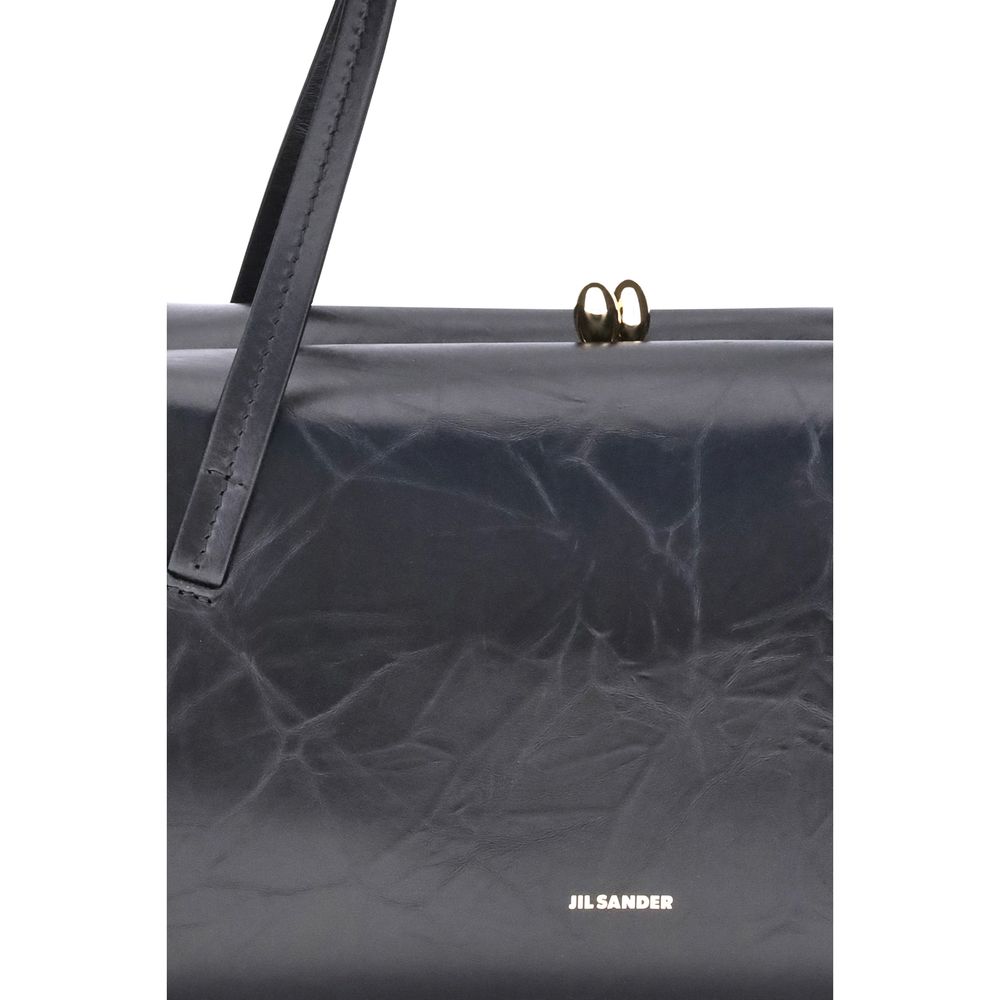 Small Shoulder Clutch Bag by Jil Sander for women in bos taurus calf leather black presents a versatile silhouette, showcasing a secure snap and versatile cardholder with versatile shoulder-strap & handle for a sophisticated look.