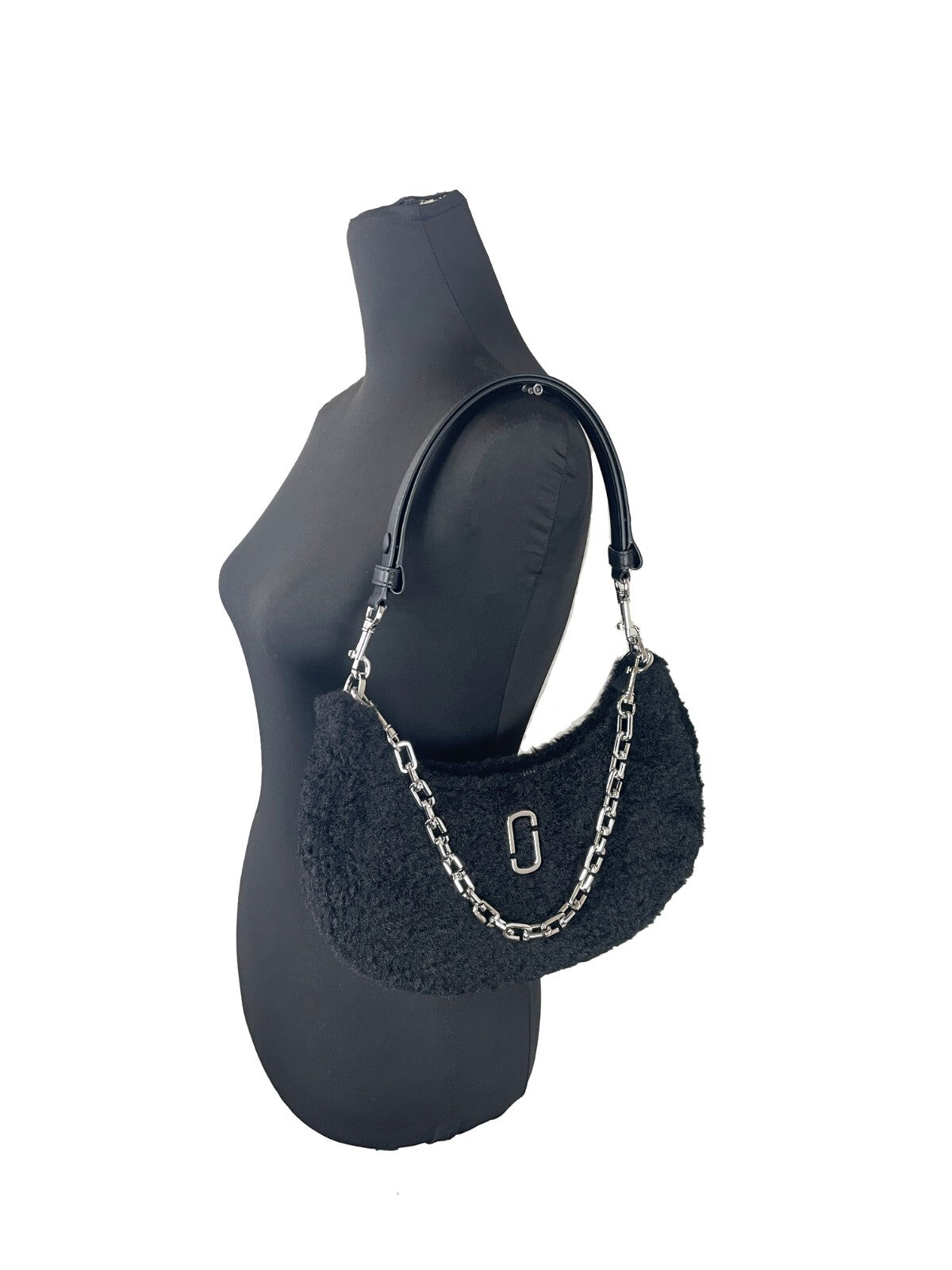 Medium Crossbody Travel Tote Handbag by Marc Jacobs for women in faux polyester fur black & silver features an refined silhouette, showcasing a secure zipper, ample , and versatile crossbody-strap, detachable-strap & handle for a sophisticated refined aesthetic.