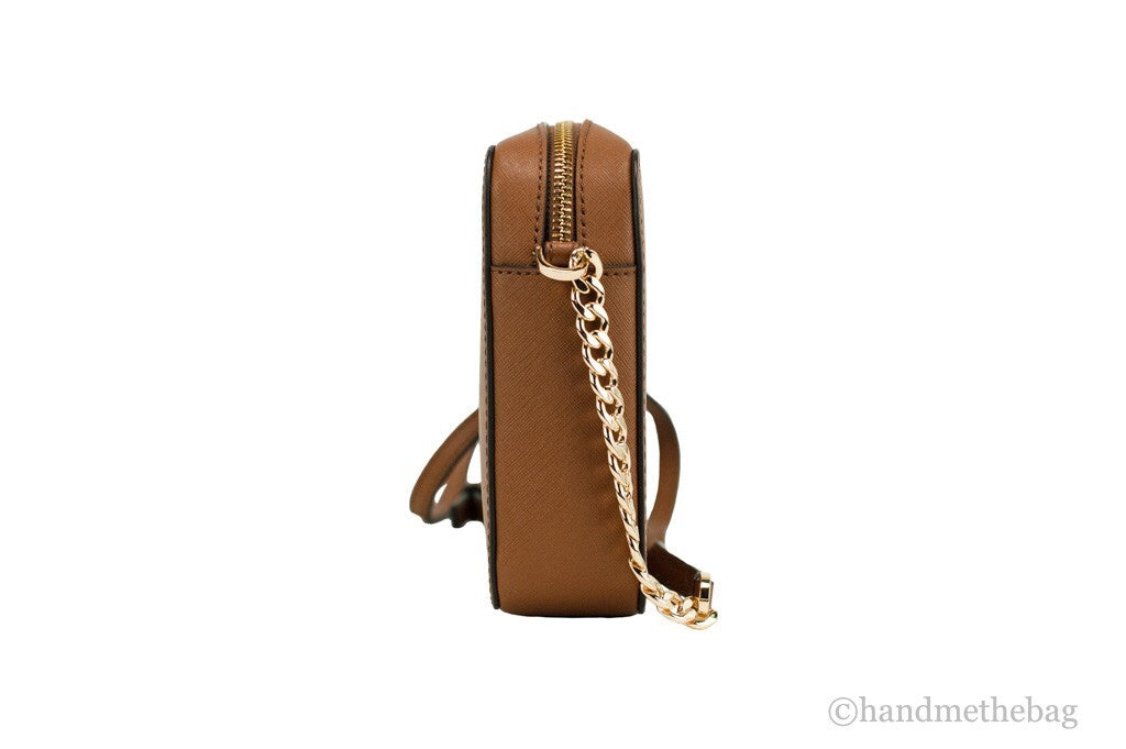Crossbody Handbag by Michael Kors for women in leather & rubber brown, gold & signature features a transformative elegance silhouette, showcasing a secure zipper, organized , and versatile crossbody-strap & adjustable-strap for a transformative elegance look.
