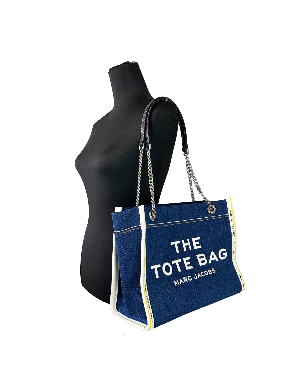 Medium Tote Bag by Marc Jacobs for women in stretch denim & viscose silver features a jet-set The Tote Stretch Denim & Viscose Medium Bag design, complete with a secure zipper, ample , and versatile for a jet-set look.