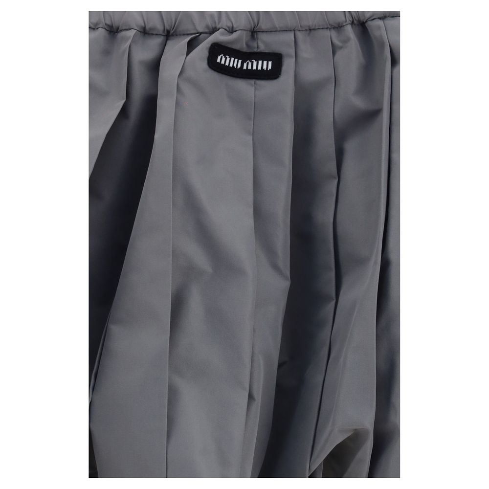 Skirt by Miu Miu for women in polyester gray features an relaxed-yet-refined silhouette that elegantly showcases the Women's Polyester Mini Skirt design and sophisticated mini.