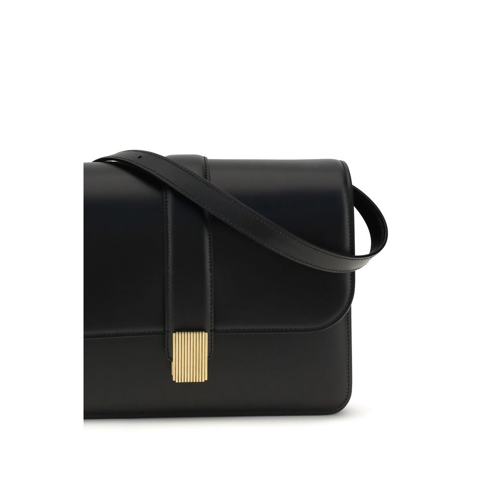 2-in-1 Shoulder & Crossbody Flap Bag by Khaite for women in bos taurus calf leather black & gold presents a versatile silhouette, showcasing a secure flap and versatile with versatile crossbody-strap, shoulder-strap & adjustable-strap for a sophisticated look.