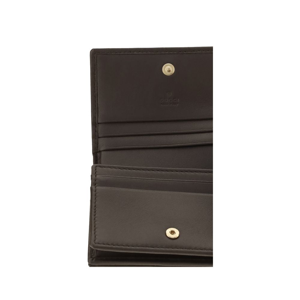 Cardholder Wallet by Gucci for women in bos taurus calf nappa leather brown, gold, patterned & chevron showcases a discerning silhouette, artfully capturing the essence of Gg Marmont Bos Taurus Calf Nappa Leather Cardholder Wallet with its functional card-organization.