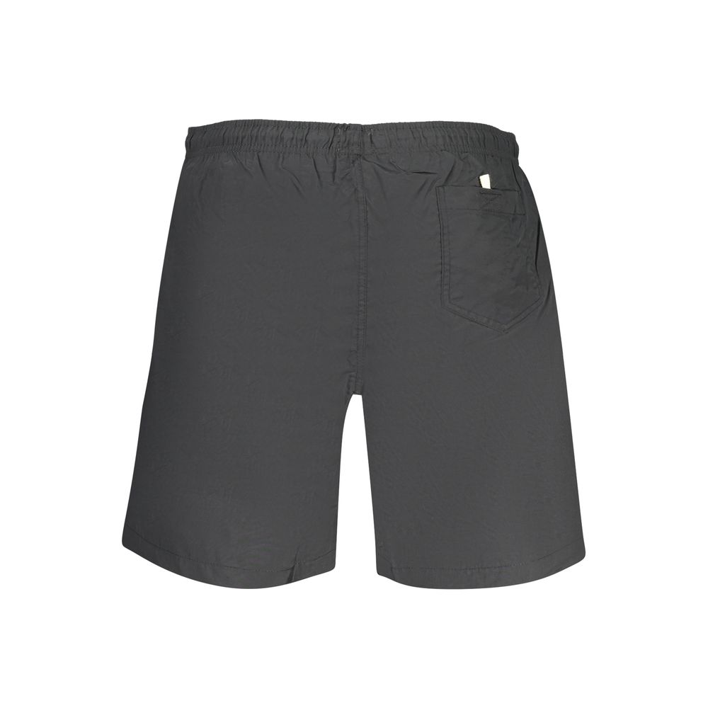 Swim Shorts by U.S. Grand Polo for men in polyamide black features an dramatic silhouette that defines the luxurious aesthetic and refined cut of the Men's Polyamide Swim Shorts.
