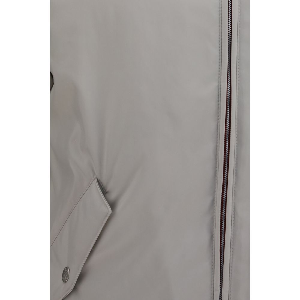Hooded Windbreaker Jacket by Brunello Cucinelli for men in polyester gray features an enduring silhouette, showcasing technical water-resistant, pockets, hooded & windproof and a sophisticated for a truly enduring aesthetic.