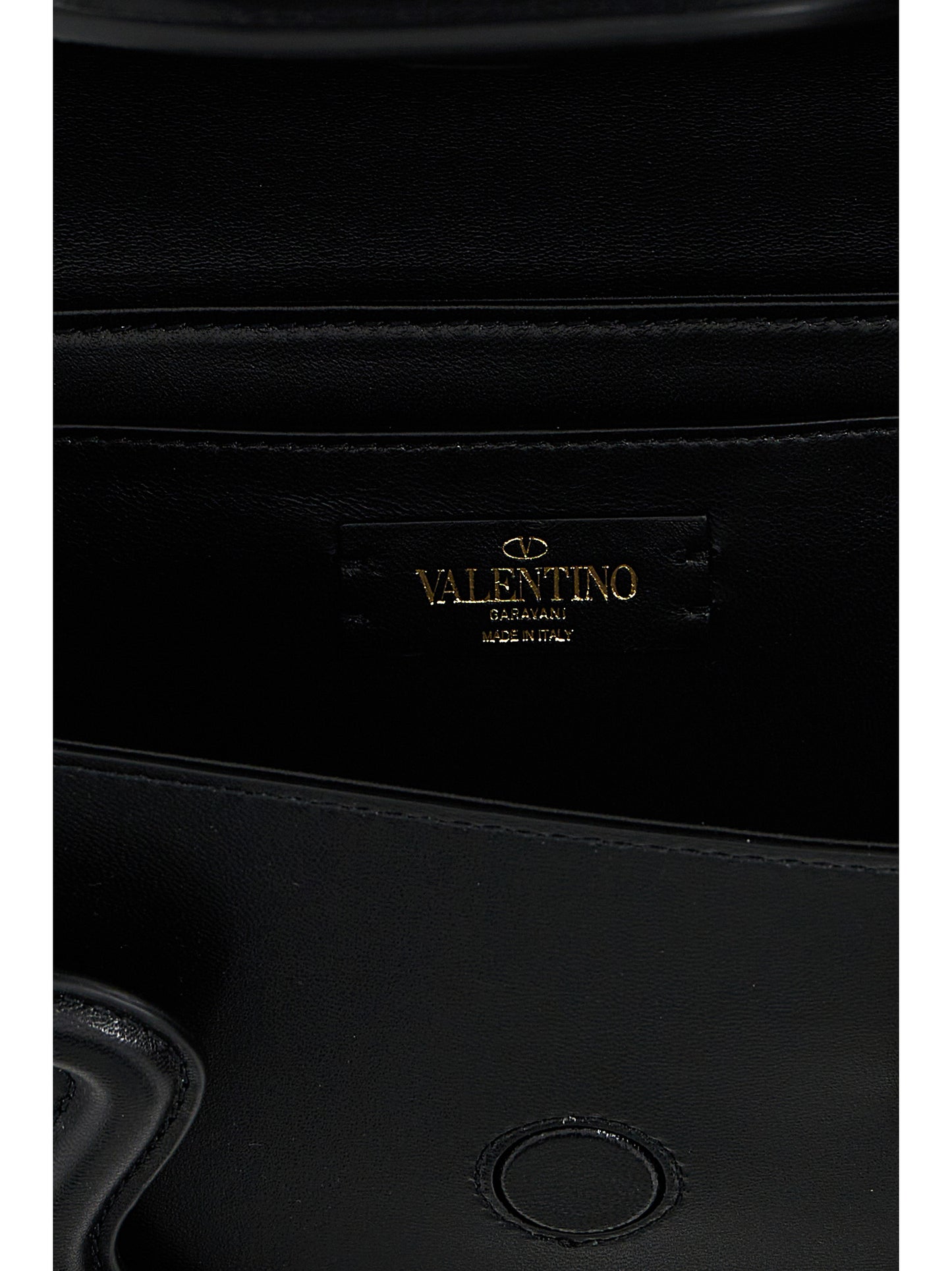 Shoulder Flap Bag by Valentino Garavani for women in leather & metal black & signature presents a statuesque silhouette, showcasing a secure flap & magnetic and statuesque with versatile shoulder-strap, adjustable-strap & handle for a sophisticated look.