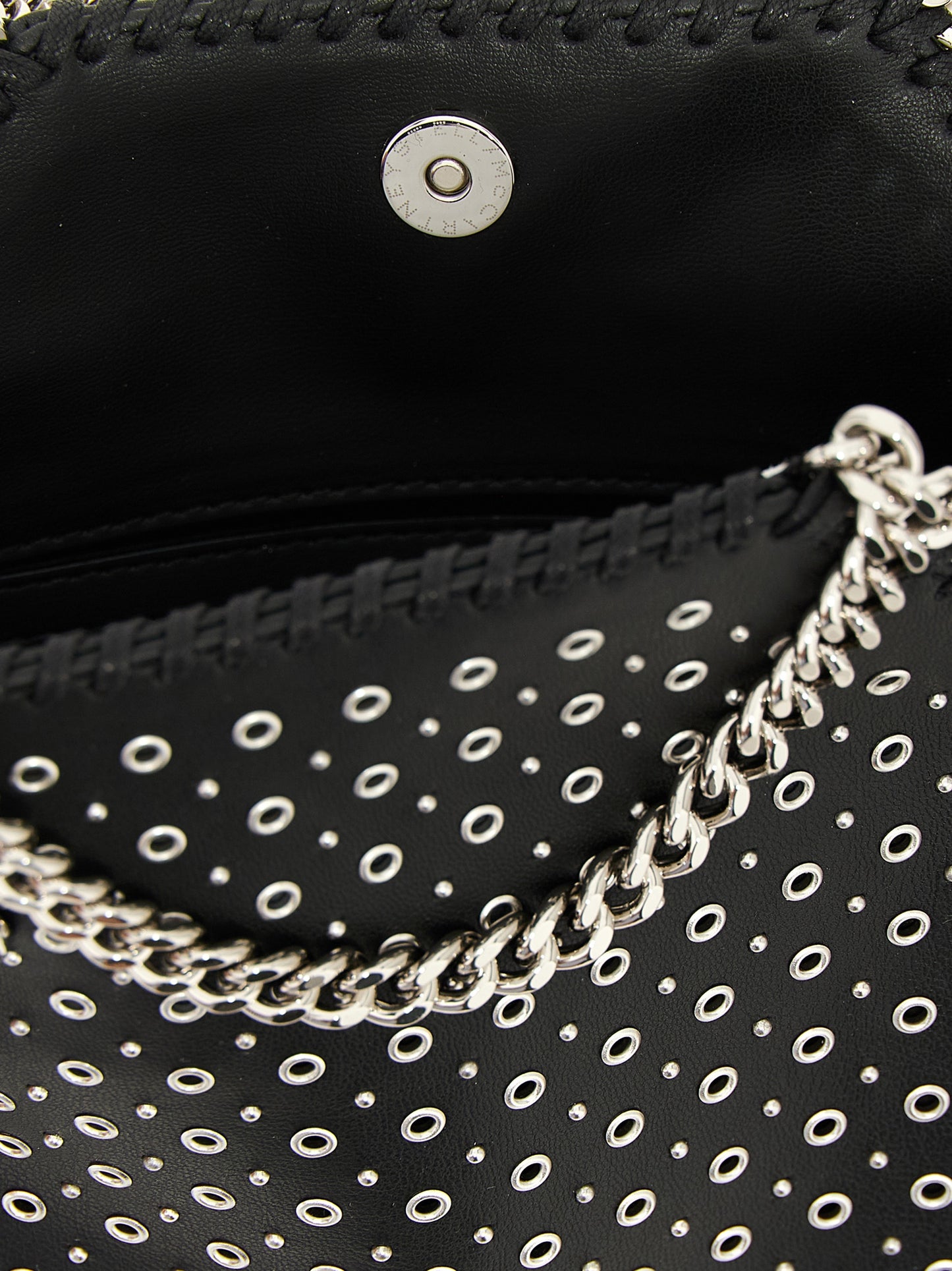 Handbag by Stella McCartney for women in polyurethane leather black features a exquisite silhouette, showcasing a secure magnetic and exquisite with versatile shoulder-strap & handle for a exquisite finish.