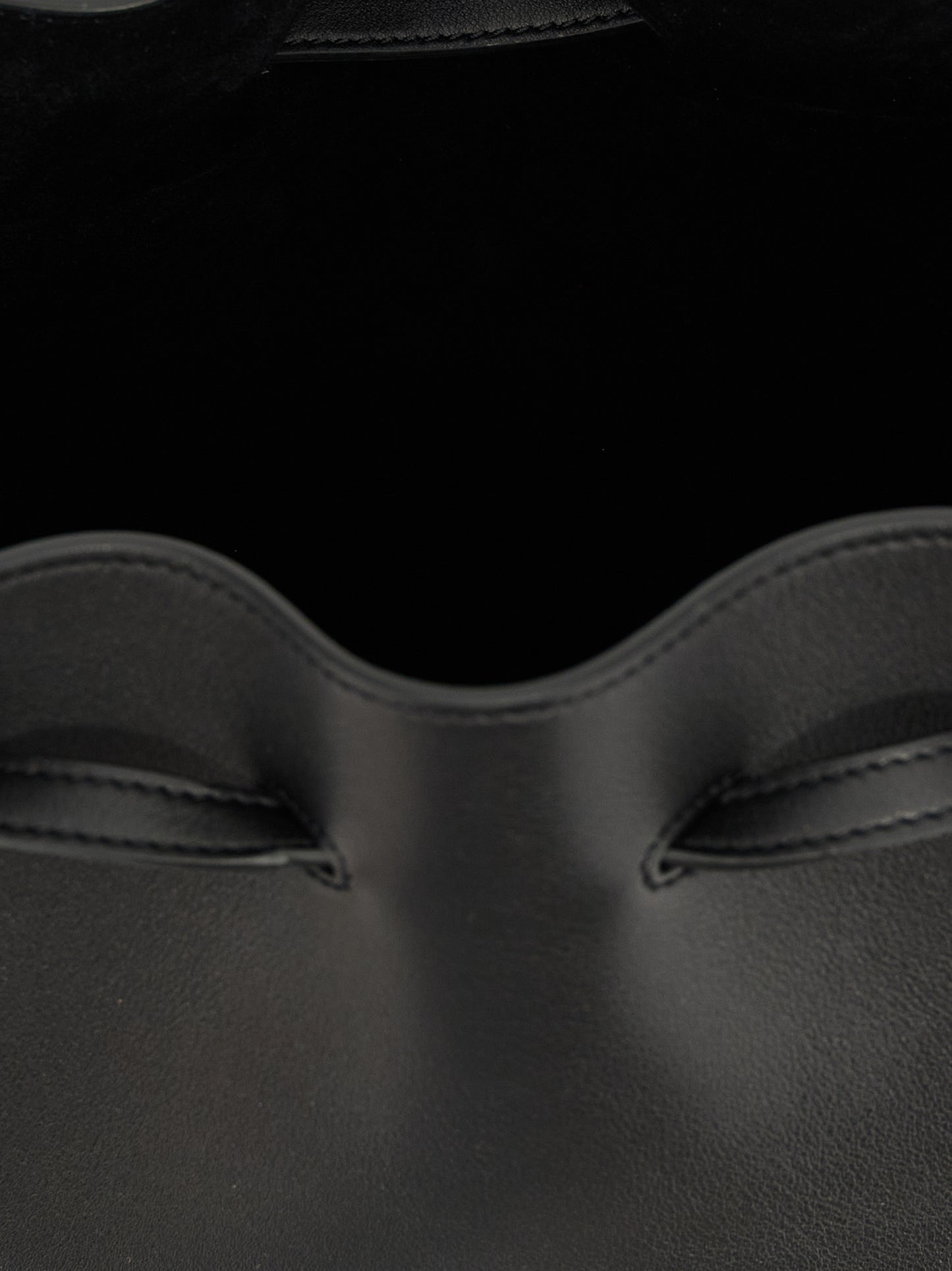 Shoulder Drawstring Bag by Valentino Garavani for women in calfskin leather black & signature features a stately silhouette, showcasing a secure drawstring, ample , and stately shoulder-strap, adjustable-strap & handle for a stately finish.