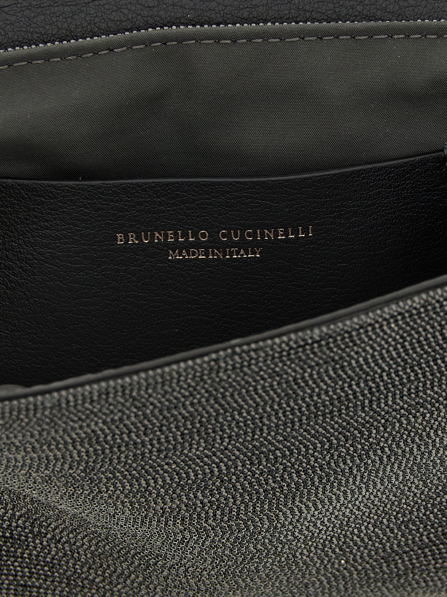 Shoulder Flap Clutch Handbag by Brunello Cucinelli for women in leather black features a statuesque silhouette, showcasing a secure flap & magnetic and organized with versatile shoulder-strap & adjustable-strap for statuesque evening wear.