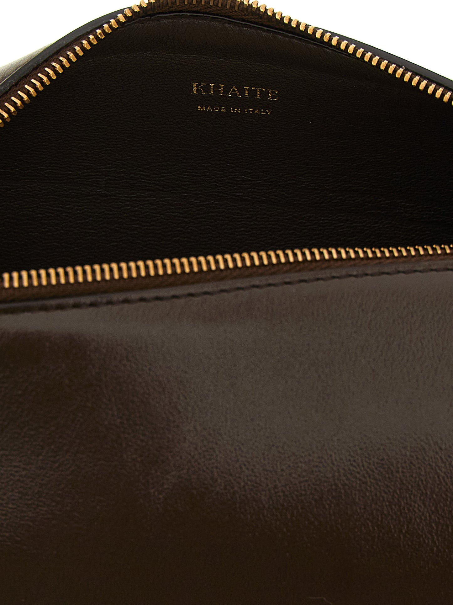 Mini East West Crossbody Handbag by Khaite for women in calfskin leather brown features a transformative sophistication silhouette, showcasing a secure zipper, ample , and versatile crossbody-strap, shoulder-strap & adjustable-strap for a transformative sophistication look.