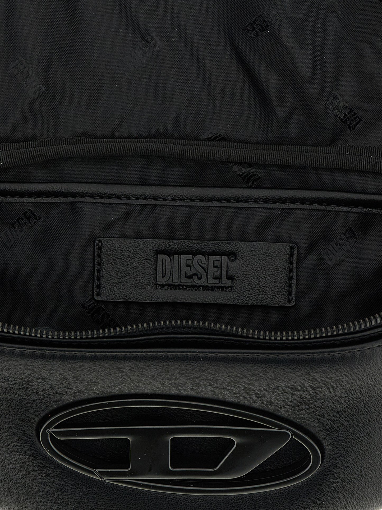 This Crossbody Messenger Bag by Diesel for men in polyethylene & polyurethane black presents a versatile silhouette from the Holi D Polyethylene & Polyurethane Crossbody Messenger Bag collection, featuring a secure , ample , and versatile crossbody-strap, shoulder-strap & adjustable-strap.
