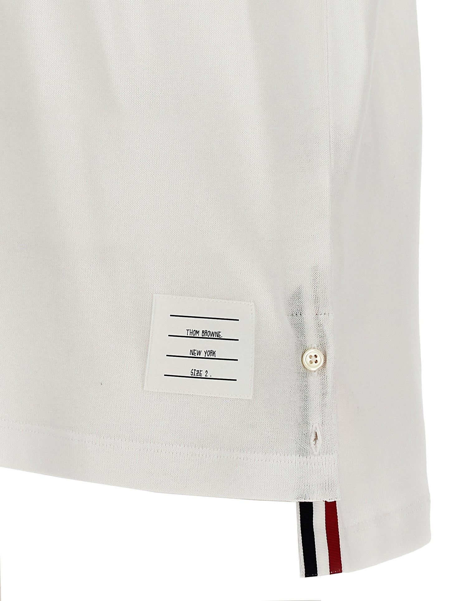 This Polo Shirt by Thom Browne for men in cotton white presents a flawless silhouette, showcasing flawless detailing and a refined for a truly flawless aesthetic.