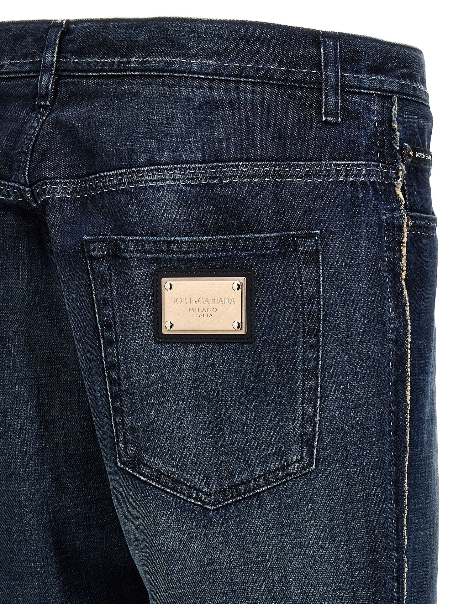 Jeans by Dolce & Gabbana for men in denim cotton blue features an sartorial skinny-leg & skinny and long with a cut for a sartorial finish.