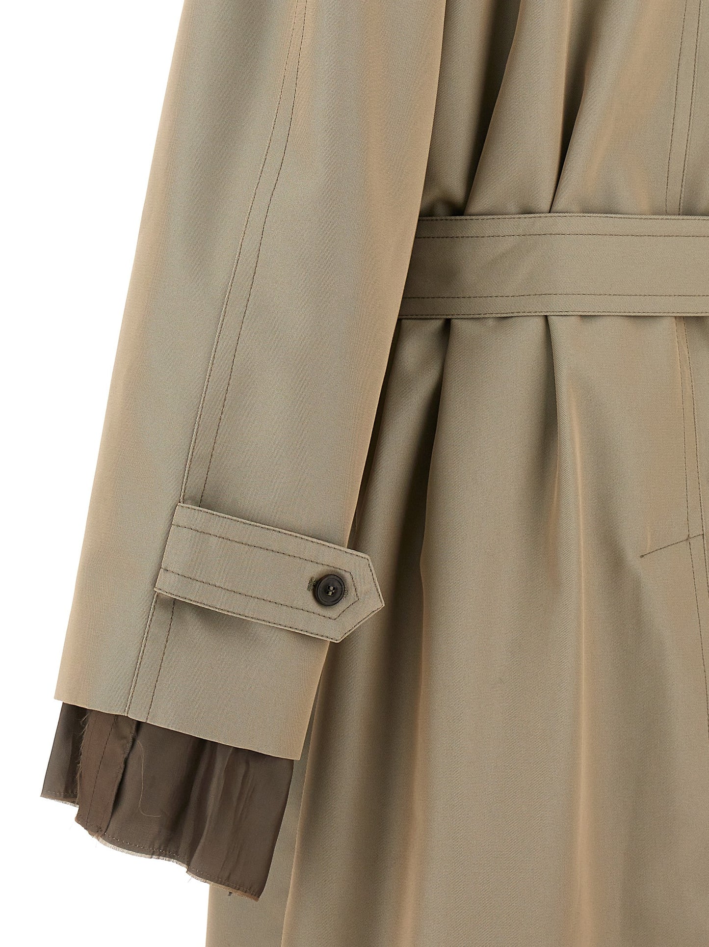 Trench Coat by Maison Margiela for men in cotton polyester beige features an dramatic silhouette, perfectly showcasing the elegant and sophisticated pockets for a truly dramatic aesthetic.
