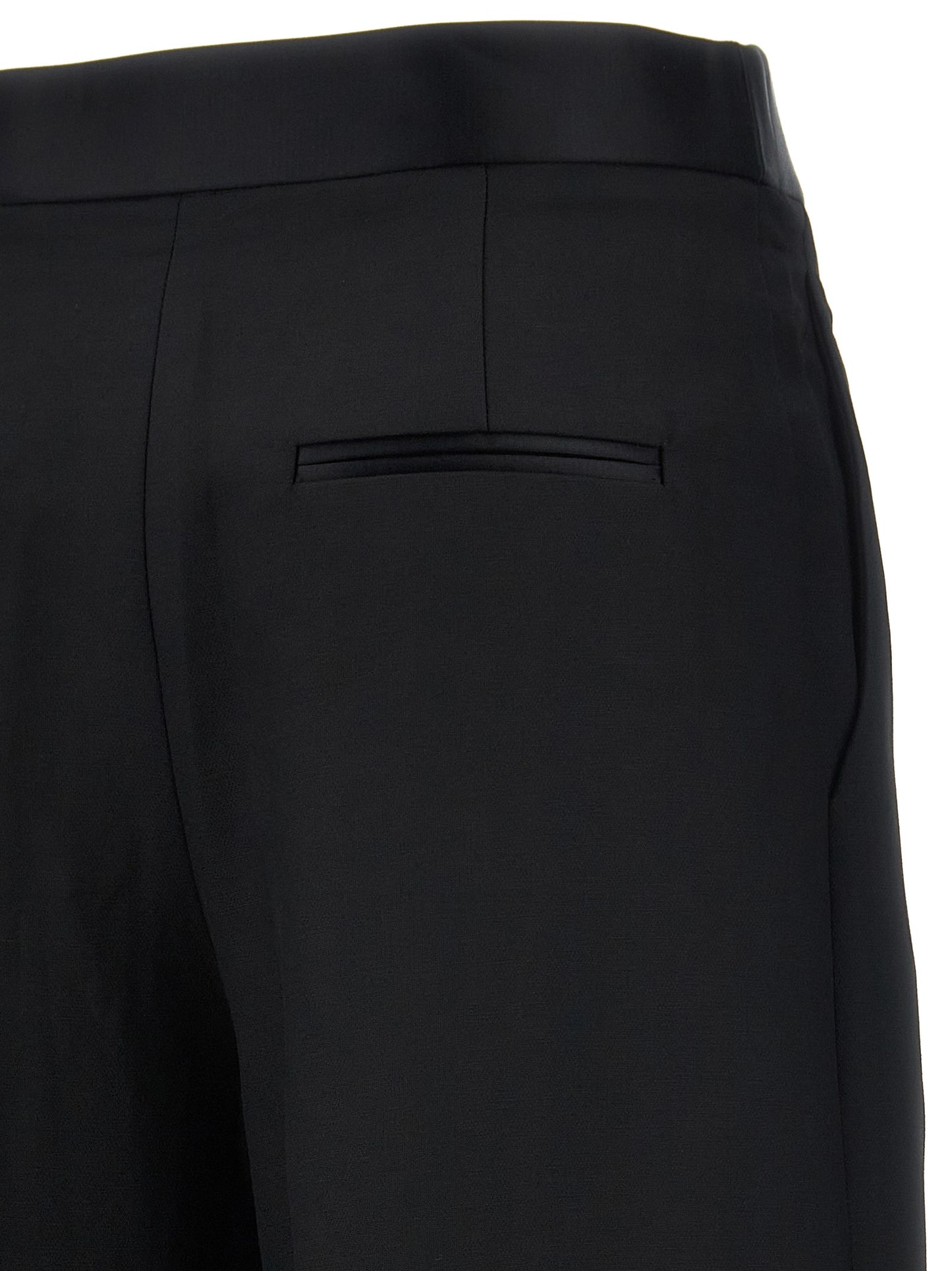 Trousers by Khaite for women in polyamide viscose black presents a perennial silhouette, meticulously tailored with a wide cut, long finish, and an elegant .