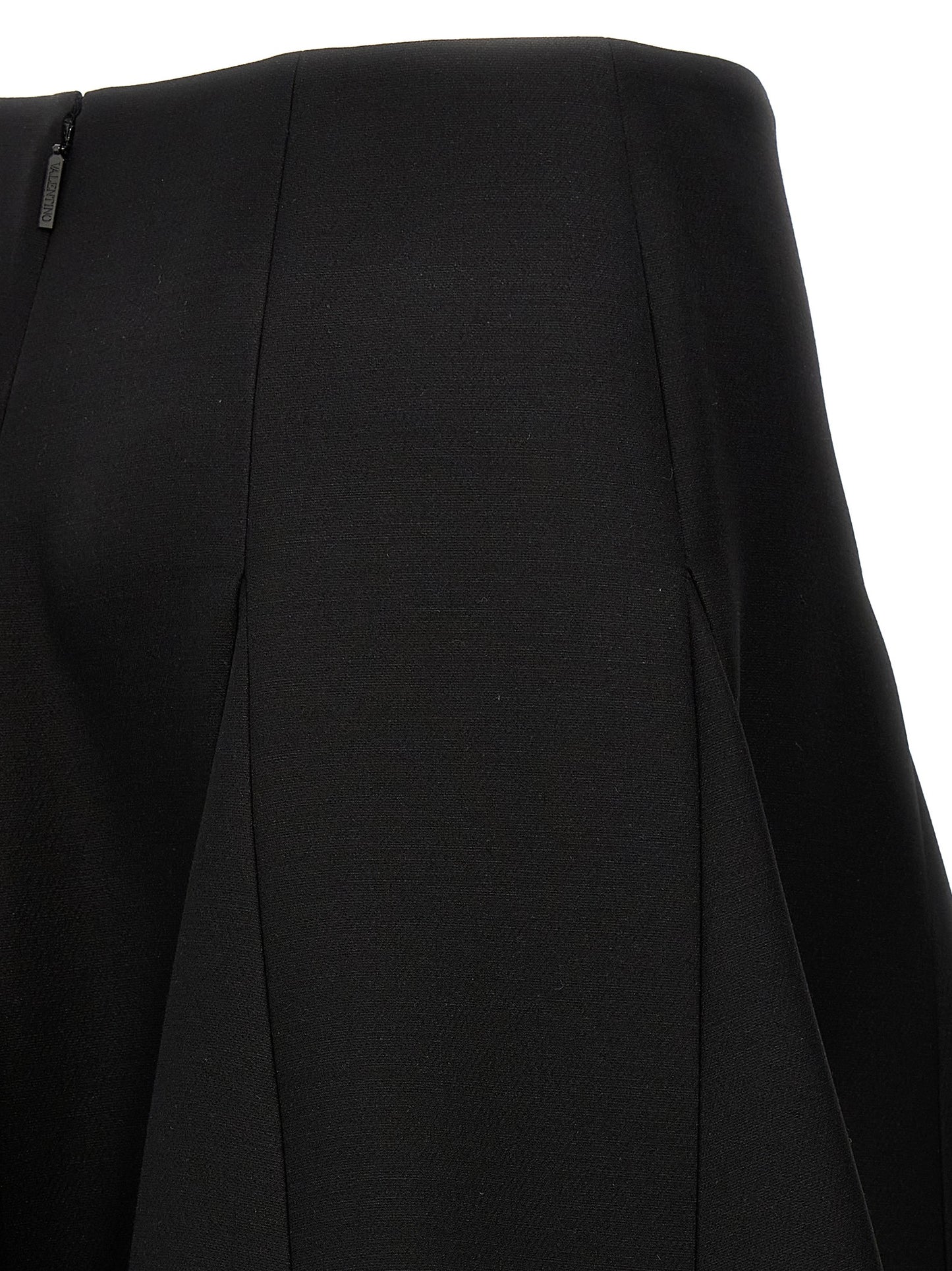 Skirt by Valentino Garavani for women in silk crepe & virgin wool black features a contoured silhouette from the Women's Silk Crepe & Virgin Wool Mini Skirt collection, characterized by its contoured mini for a contoured finish.
