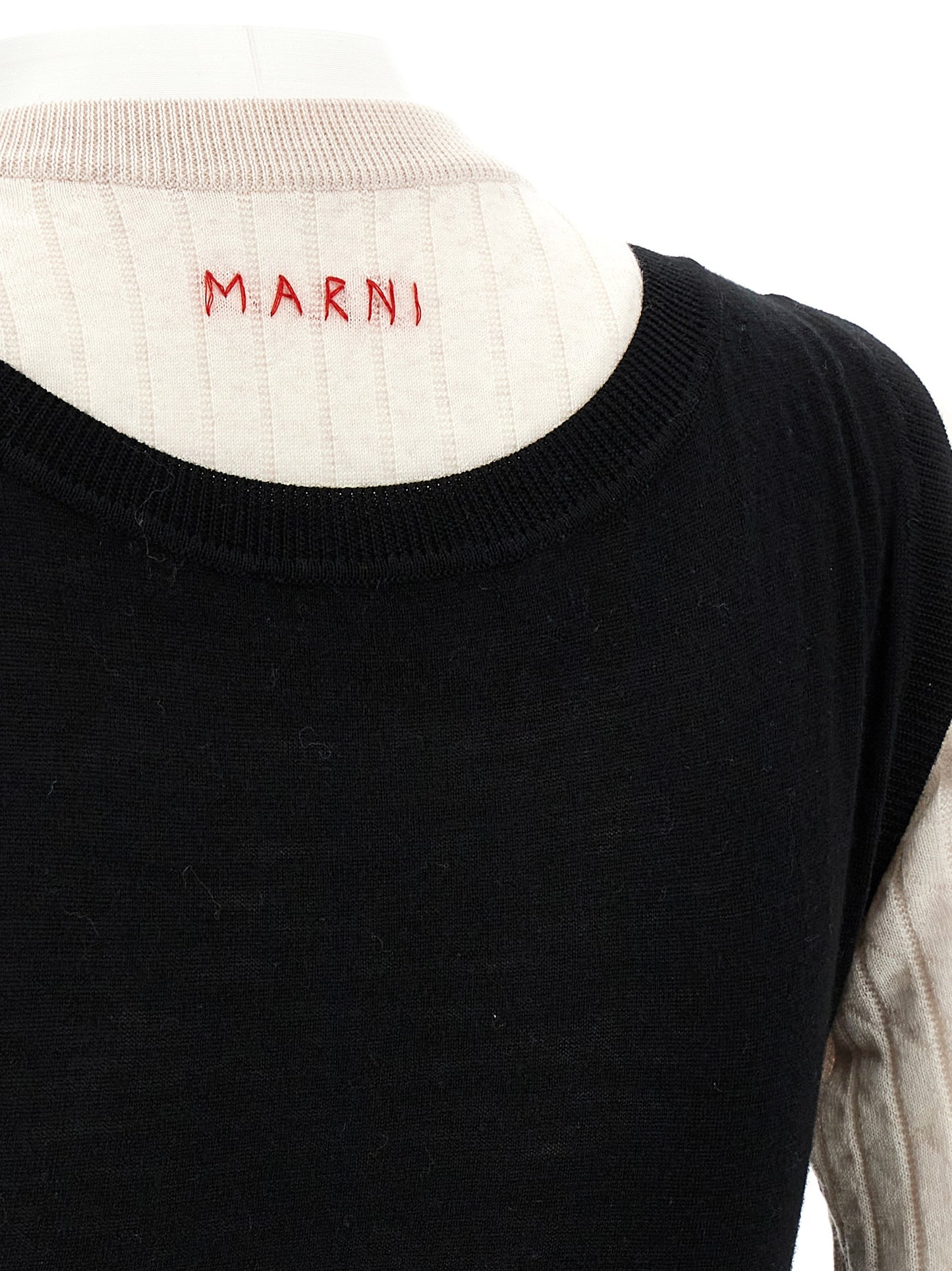 Dress by Marni for women in wool bicolour, black & white showcases a striking silhouette, elegantly detailed with a , refined , and a striking midi for a striking finish.