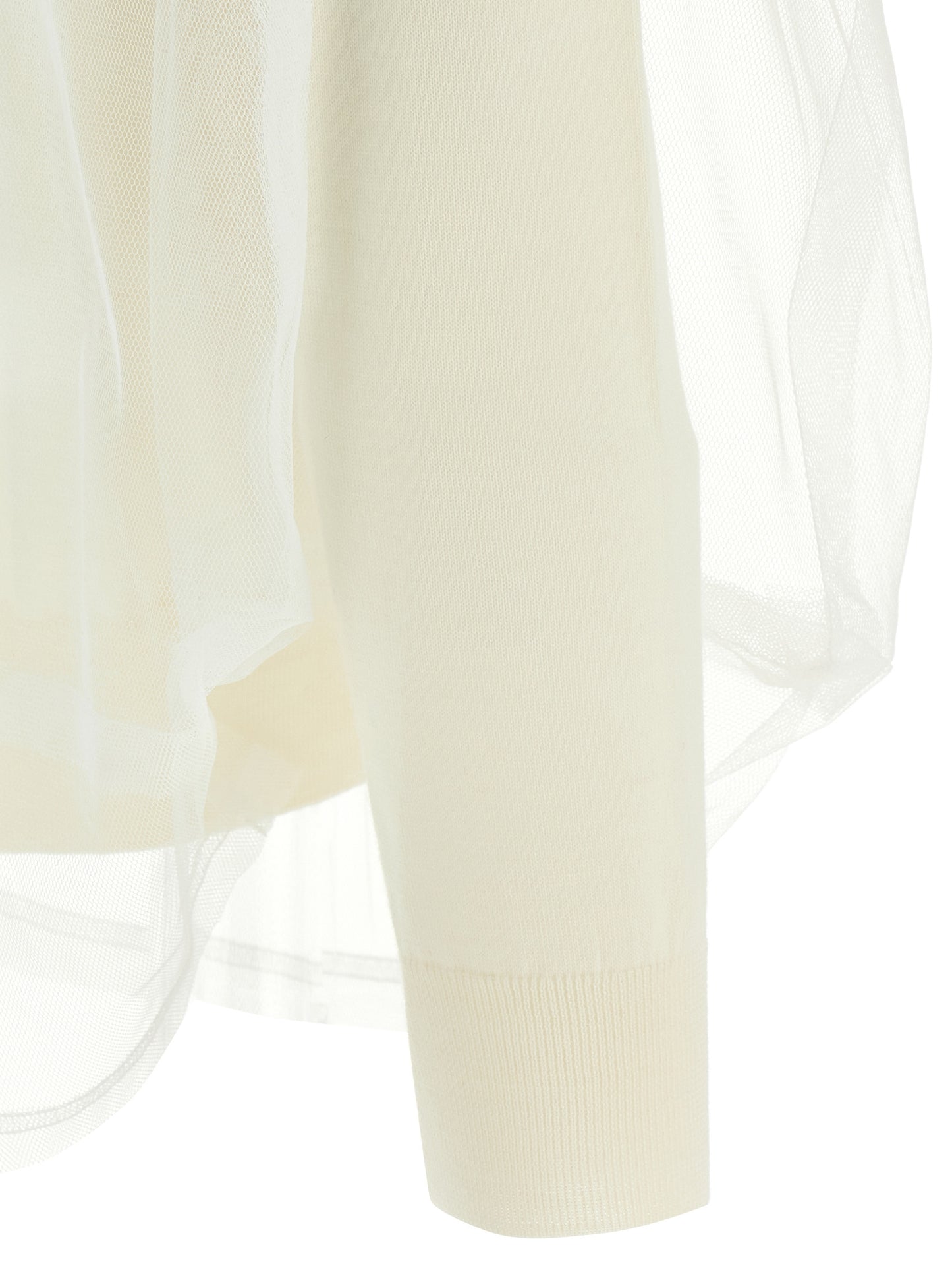 Cardigan by Comme Des Garçons for women in wool white showcases a captivating silhouette, artfully detailed with a captivating and for a truly sophisticated captivating look.