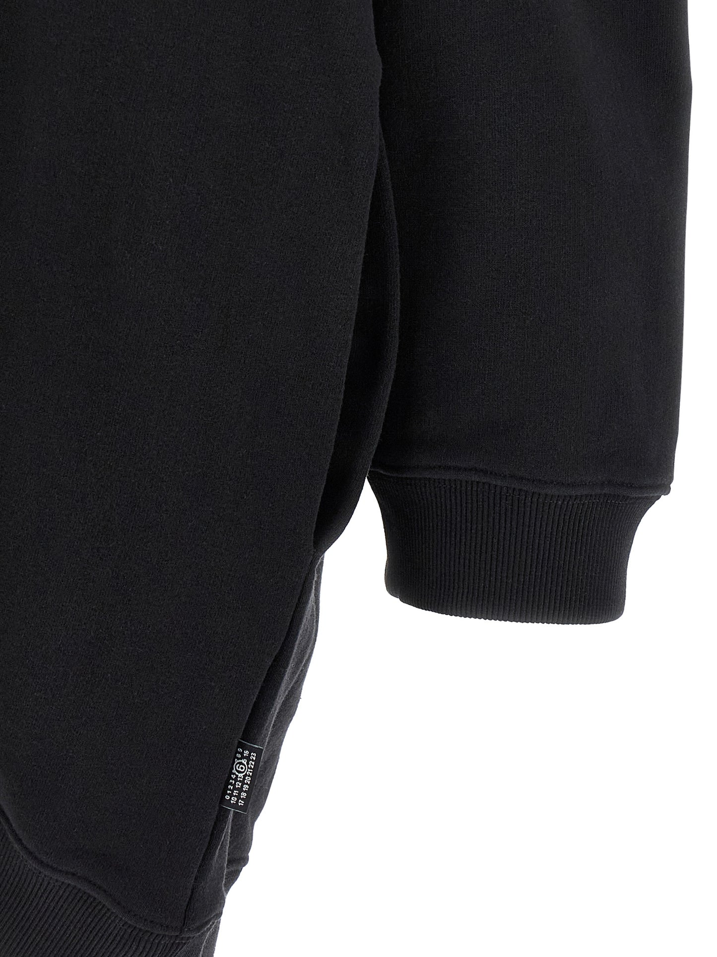 Hooded Dress by MM6 Maison Margiela for women in cotton black, white & signature features a dramatic silhouette, showcasing an elegant and that flows into a dramatic short mini.