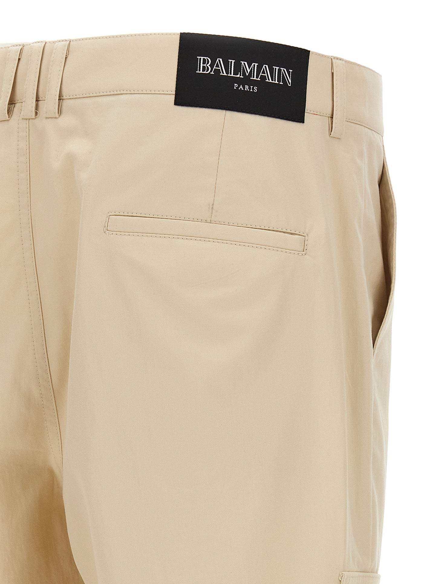 Cargo Pants by Balmain for men in cotton beige & signature features an smart casual straight-leg and long, expertly tailored with a and smart casual utilitarian details for a sophisticated look.