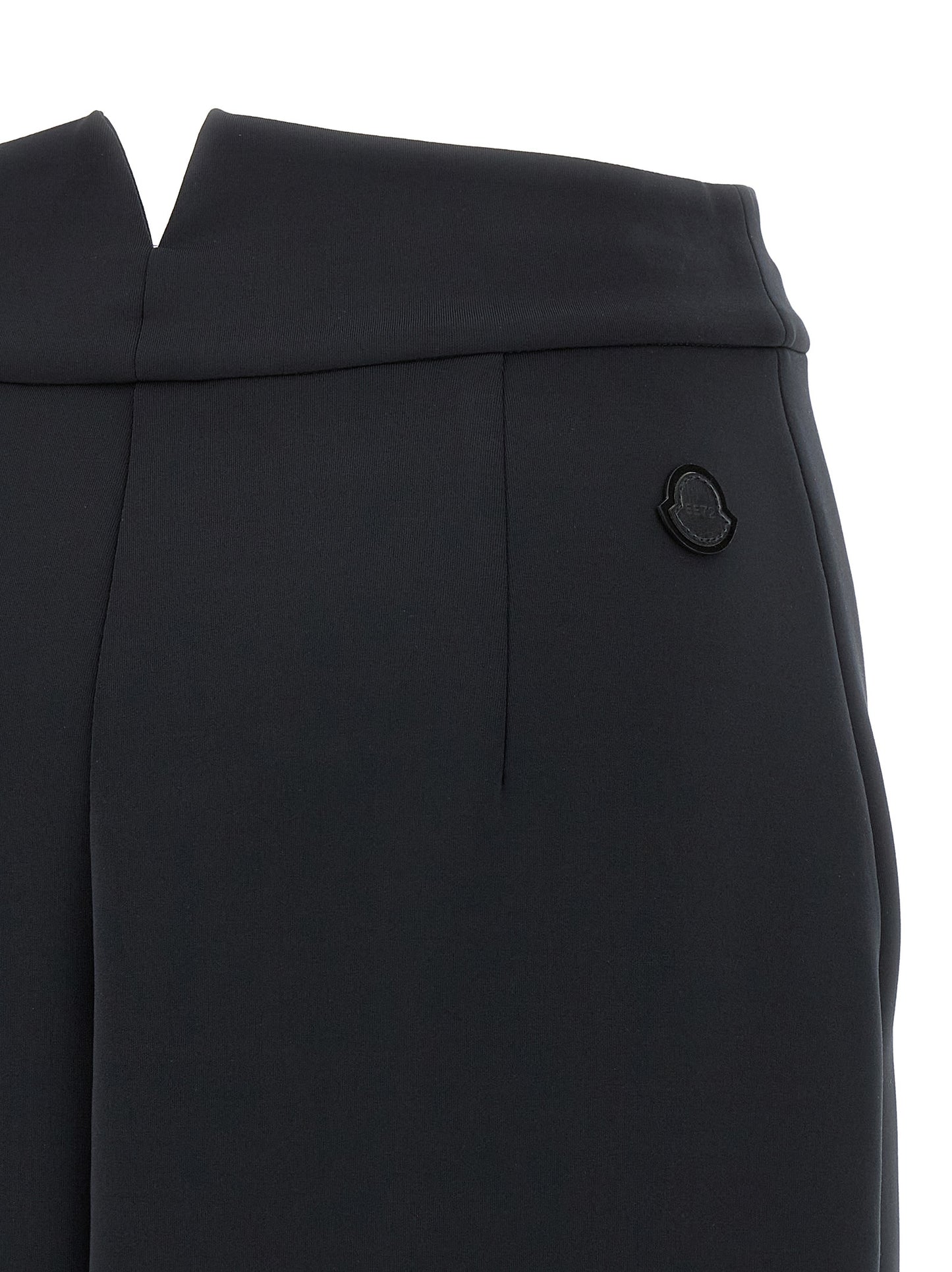 Skirt by MONCLER GENIUS for women in stretch polyester black showcases a sultry silhouette, elegantly defined by its midi and the sophisticated sultry design of the Women's Stretch Polyester Midi Skirt.