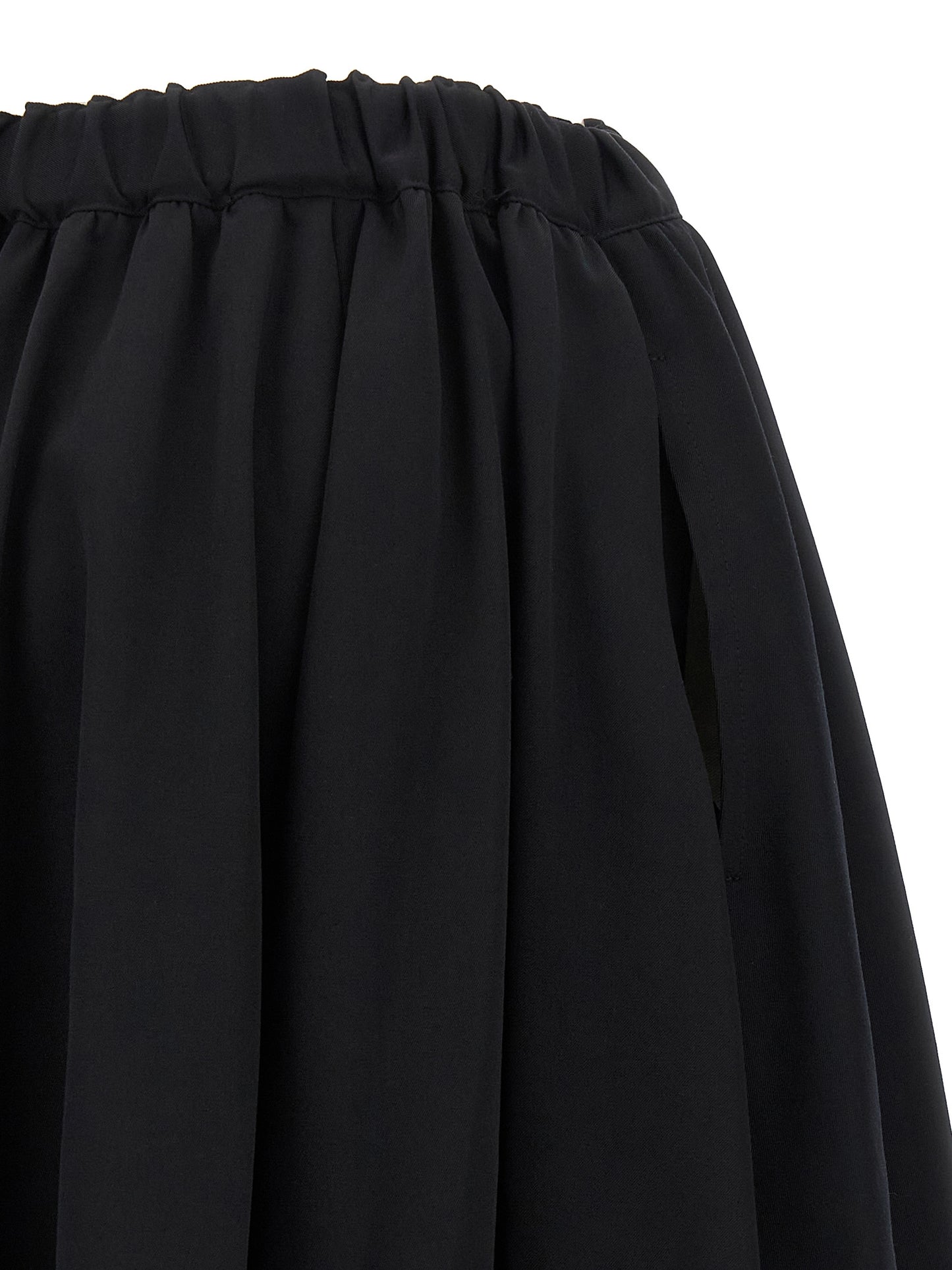Skirt by Comme Des Garçons for women in wool black showcases a sultry silhouette, elegantly defined by its maxi mini and the sophisticated sultry design of the Women's Wool Maxi Mini Skirt.