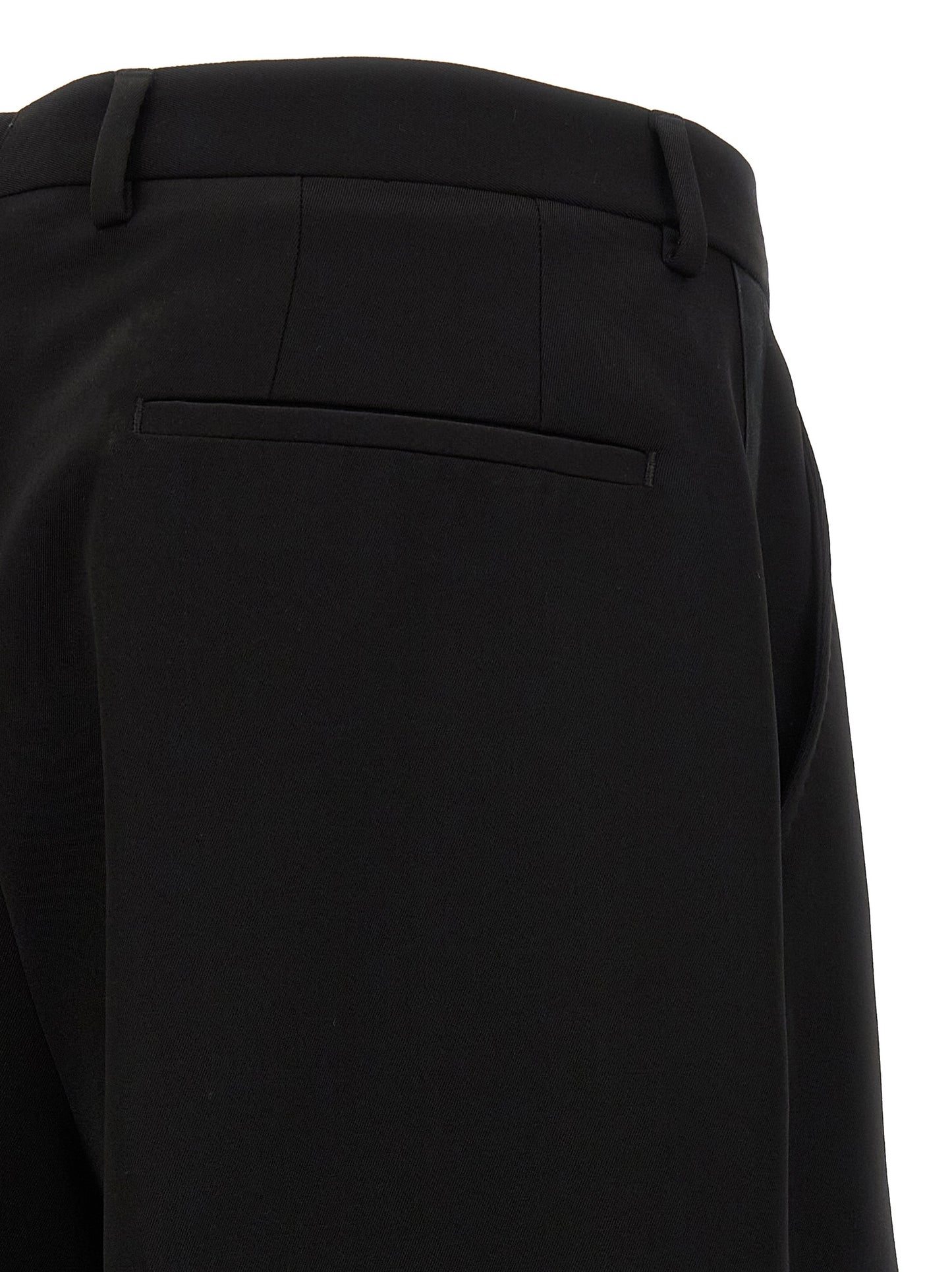 Trousers by Dolce & Gabbana for men in virgin wool black features an sartorial silhouette, showcasing a precise straight-leg & wide and long with a sartorial for a refined look.