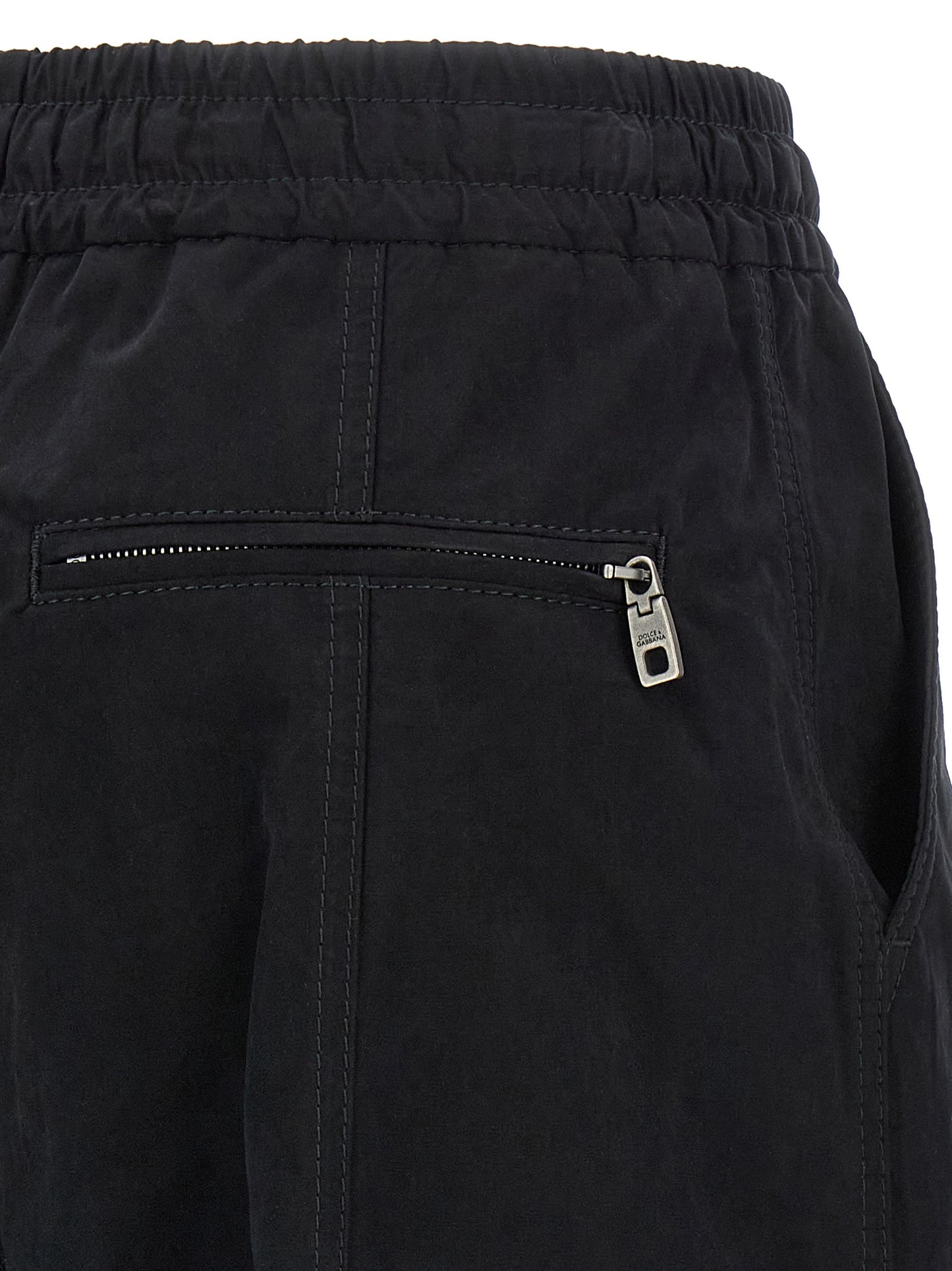 Cargo Pants by Dolce & Gabbana for women in polyamide polyester & cotton black features an tailored wide with a low rise and long, creating a tailored utilitarian silhouette.