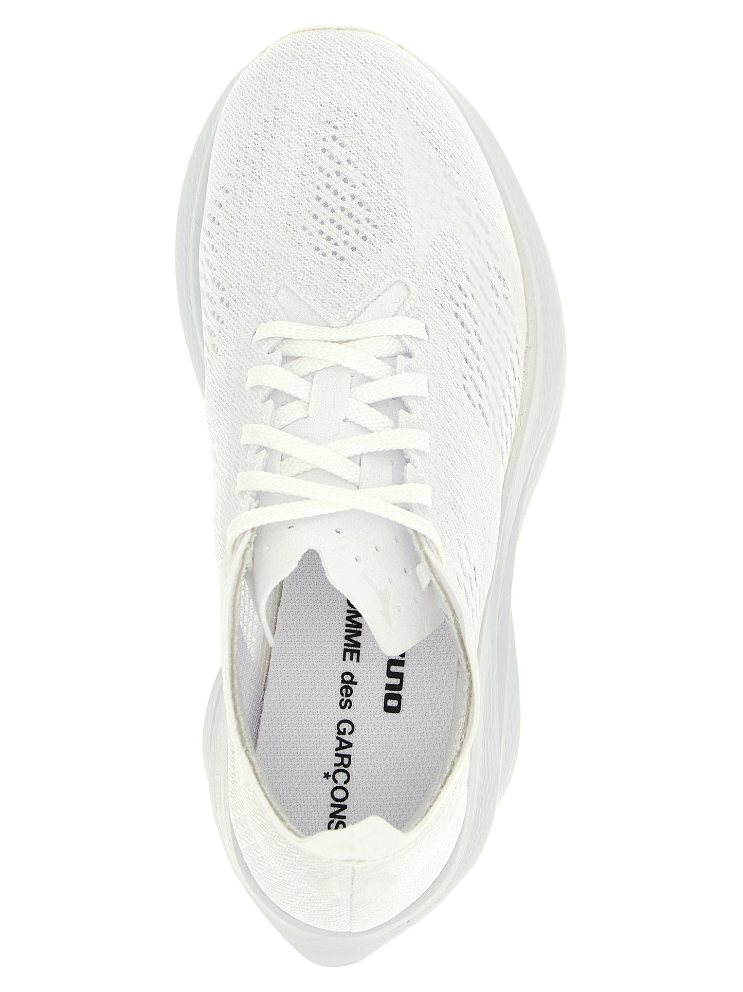 Athletic Sneakers by Comme Des Garçons for women in synthetic fabric white features an effortless chic silhouette, showcasing the signature athletic style of the Women's Athletic Synthetic Fabric Sneakers collection with a truly effortless chic finish.