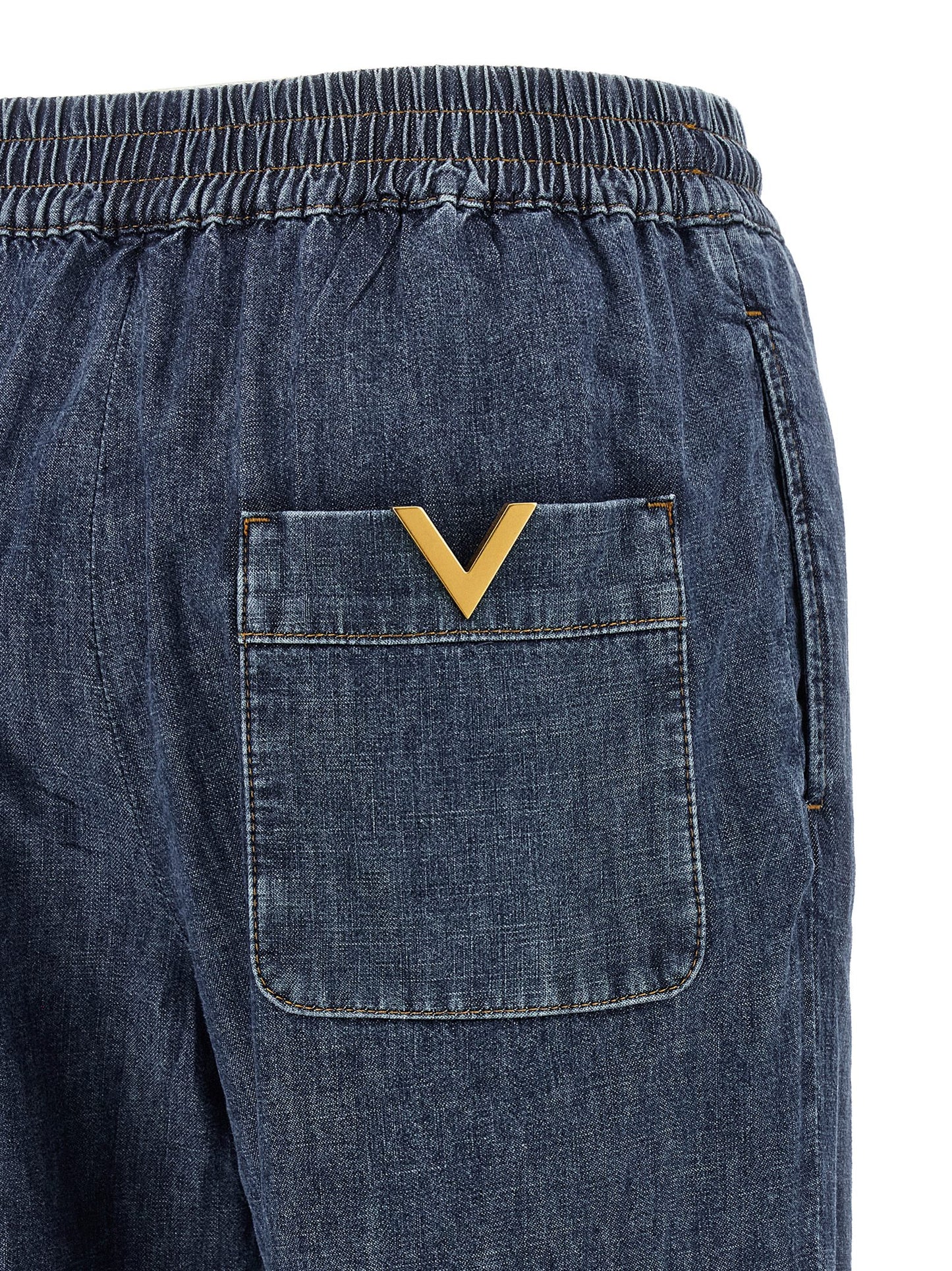 Jeans by Valentino Garavani for women in denim cotton blue presents a refined pantology silhouette, artfully defined by a refined pantology flared & wide, long, and a sophisticated .