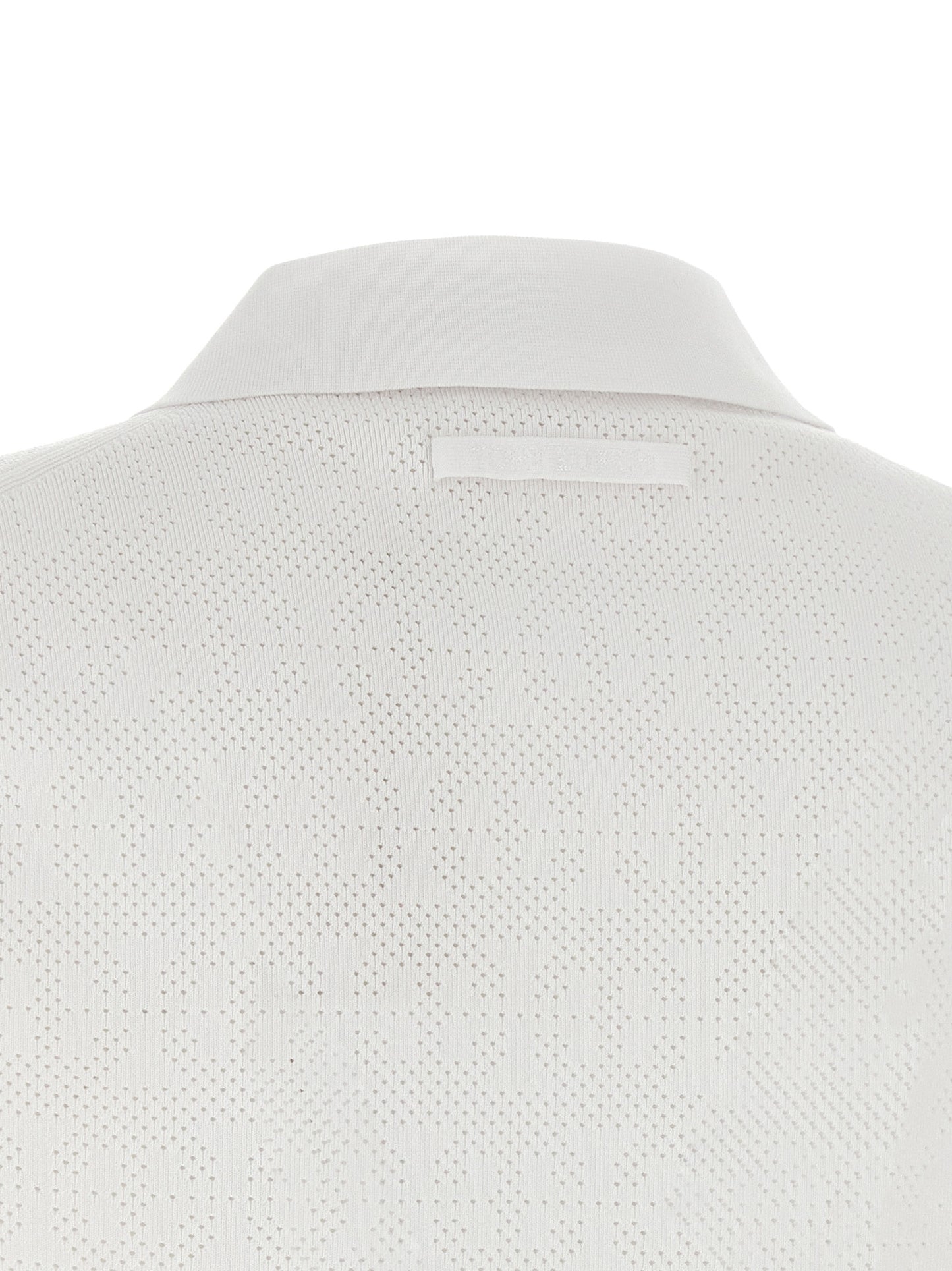Polo Shirt by Tory Burch for women in viscose polyester & polyamide white presents a crisp silhouette, artfully detailed with a crisp and crisp .