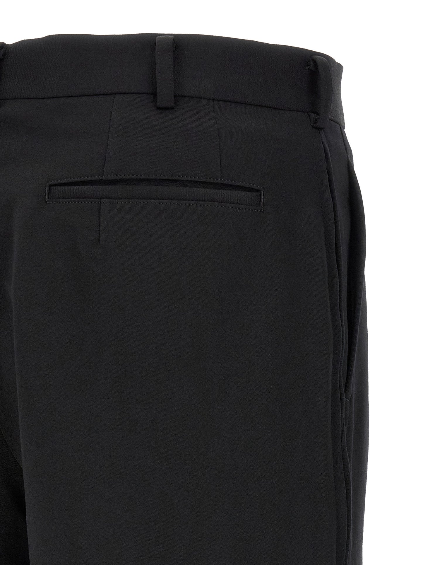 Bermuda Shorts by Comme Des Garçons for men in wool black presents a sleek silhouette, featuring a sleek straight-leg, flared & wide with a refined short and a sophisticated .