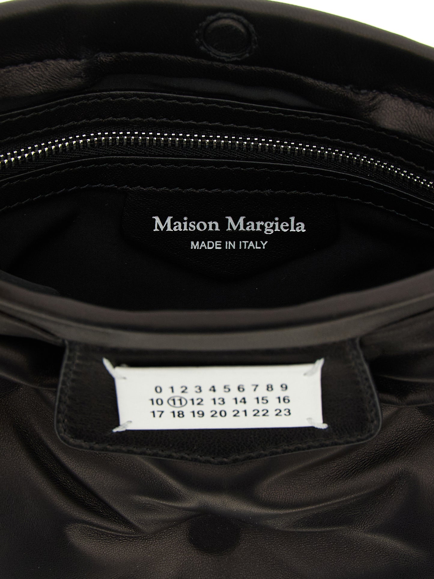 Mini 2-in-1 Shoulder & Crossbody Clutch Handbag by Maison Margiela for women in nappa lamb leather black & signature features an multi-faceted design with a secure magnetic, ample , and versatile crossbody-strap, shoulder-strap & adjustable-strap for a multi-faceted finish.