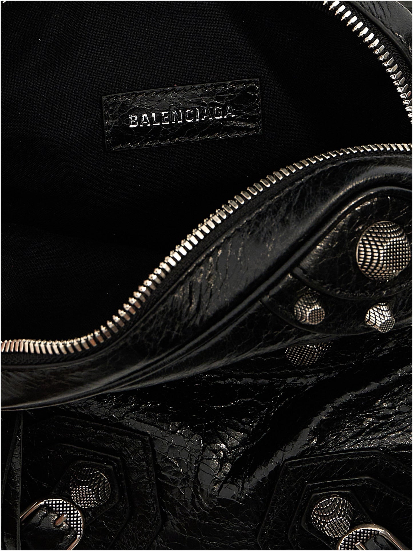 Crossbody Messenger Clutch Bag by Balenciaga for men in polyester & lamb leather black showcases a stylish Le Cagole Polyester & Lamb Leather Crossbody Messenger Clutch Bag design, featuring a secure zipper and ample with versatile crossbody-strap, shoulder-strap & adjustable-strap for a stylish look.