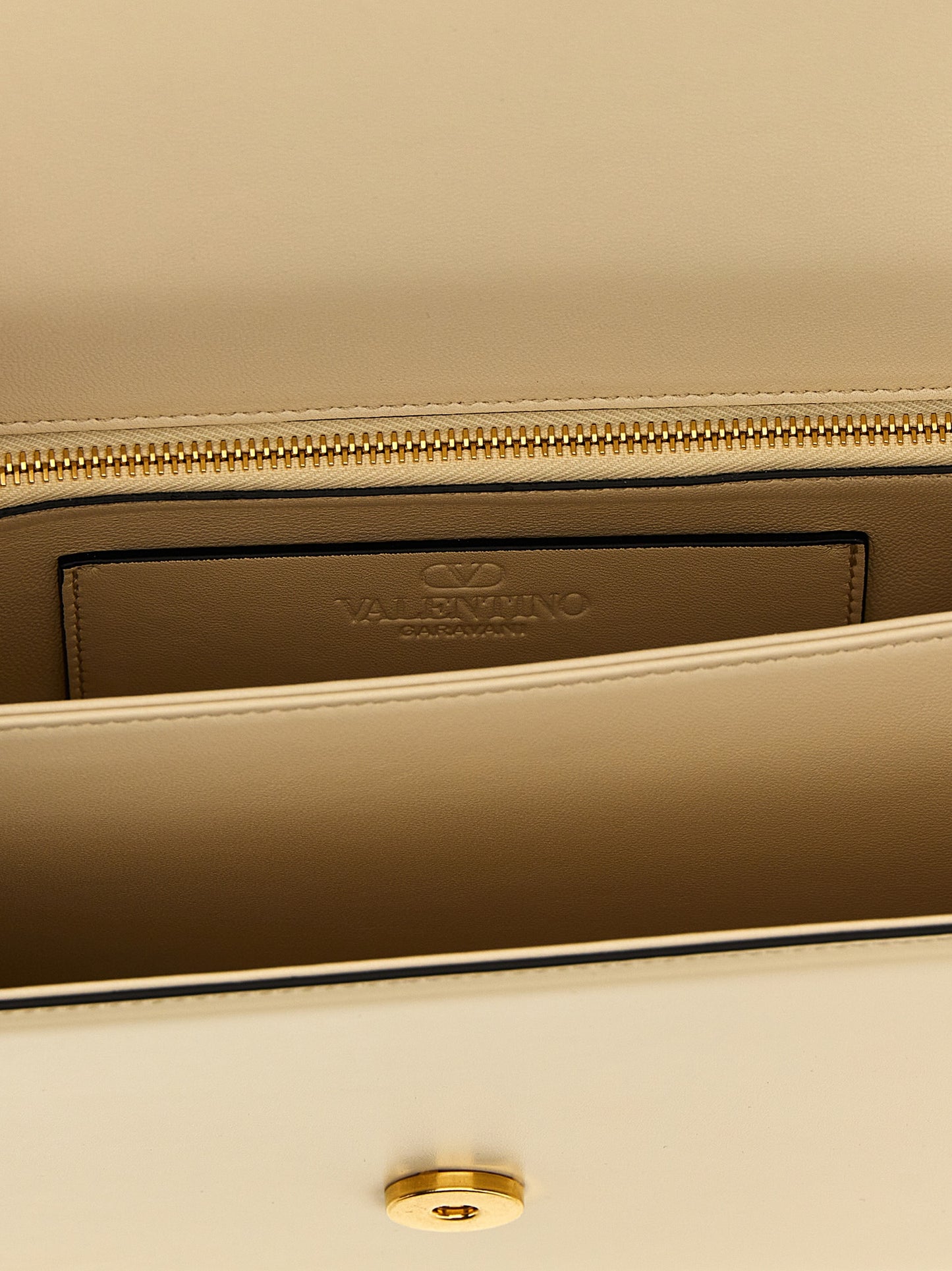 2-in-1 Shoulder & Crossbody Flap Bag by Valentino Garavani for women in bos taurus nappa & suede calf leather white & signature showcases a enviable silhouette, artfully detailed with a secure flap & magnetic, organized , and versatile crossbody-strap & shoulder-strap for a enviable look.