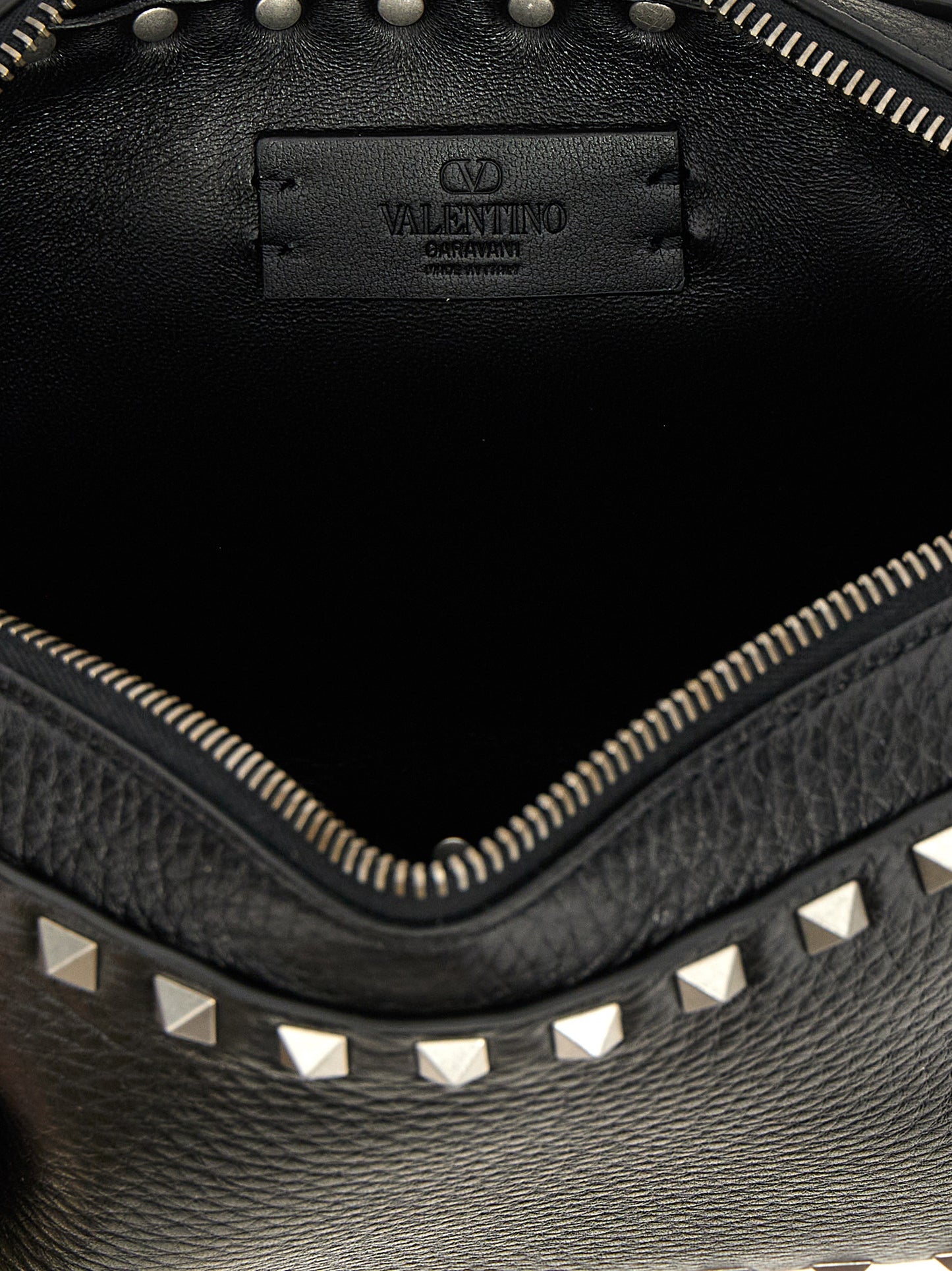 Crossbody Messenger Bag by Valentino Garavani for men in calfskin leather black features an fashionable Rockstud Calfskin Leather Crossbody Messenger Bag design with a fashionable zipper, ample , and versatile crossbody-strap, shoulder-strap & adjustable-strap for a sophisticated finish.
